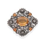 An Arts & Crafts Citrine Brooch, by Edith Linnell, an oval cut citrine in a claw setting within a