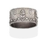 A Victorian Silver Cuff Bangle, the front with applied thistles and floral sprays, on a chased