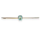 An Aquamarine Bar Brooch, an octagonal cut aquamarine in a milgrain setting to a tapered bar, length