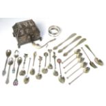 A Mexican white metal casket stamped '925' and a quantity of plated souvenir spoons
