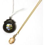 A miniature cameo pendant in mount, stamped 9ct, on chain; together with a silver and enamel fishing