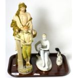 Two Austrian pottery figures, together with two Russian figures