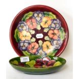 A Walter Moorcroft Clematis dish and a pansy plate (2)