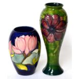 A Walter Moorcroft Magnolia pattern vase and an Anemone pattern vase (2)