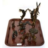 Eleven bronze figures of hares