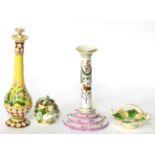 A 19th century Berlin porcelain candlestick, 19th century Paris porcelain scent bottle and