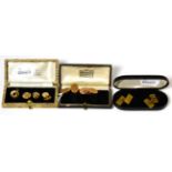 A pair of 9 carat gold engine turned double oval cufflinks, a matched set of dress studs and a