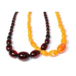 A bakelite bead necklace and an orange bead necklace