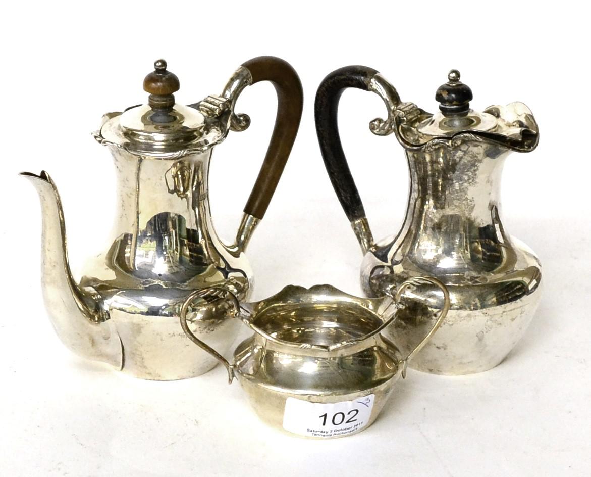 A child's silver three piece coffee service by Mappin & Webb