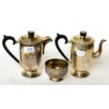 A three piece silver coffee serivce, Roberts & Dore, Birmingham 1937, the pots 17cm high, 32.4ozt