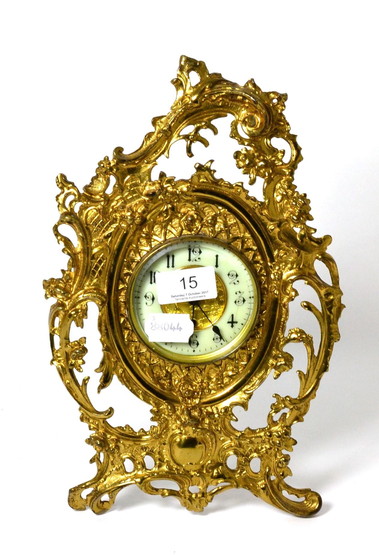 A gilt metal strut clock, the dial with Arabic numerals