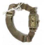 A French Art Deco lady's wristwatch, with diamond set bezel, on an 800 standard strap, stamped '