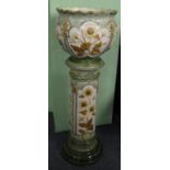 A Burmantofts Pottery Jardiniere and Stand, circa 1900, moulded with panels of flowering branches