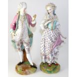 A Pair of Continental Porcelain Figures of a Lady and Gentleman, circa 1880, wearing romantic 18th
