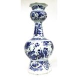 A Delft Vase, 18th century, of panelled baluster form, painted in blue with chinoiserie foliage