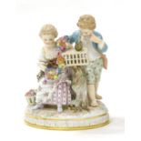 A Meissen Porcelain Figure Group, circa 1900, depicting a boy and girl in 18th century costume