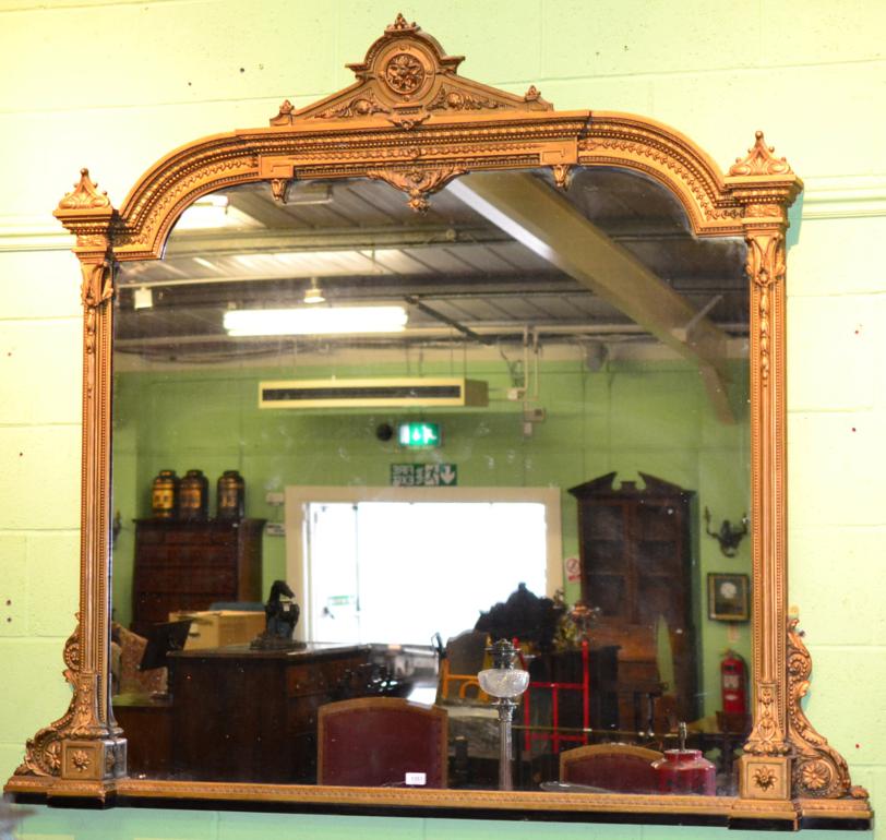 A Victorian Gilt and Gesso Overmantel Mirror, circa 1860, with original mirror plate within a beaded