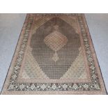 Tabriz Carpet Iranian Azerbaijan The charcoal Herati design field centred by a cusped medallion