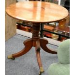 ~ A Regency Mahogany and Rosewood Crossbanded Fliptop Occasional Table, raised on a turned support