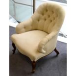 A Victorian Walnut Framed Tub Chair, late 19th century, recovered in cream button back fabric with