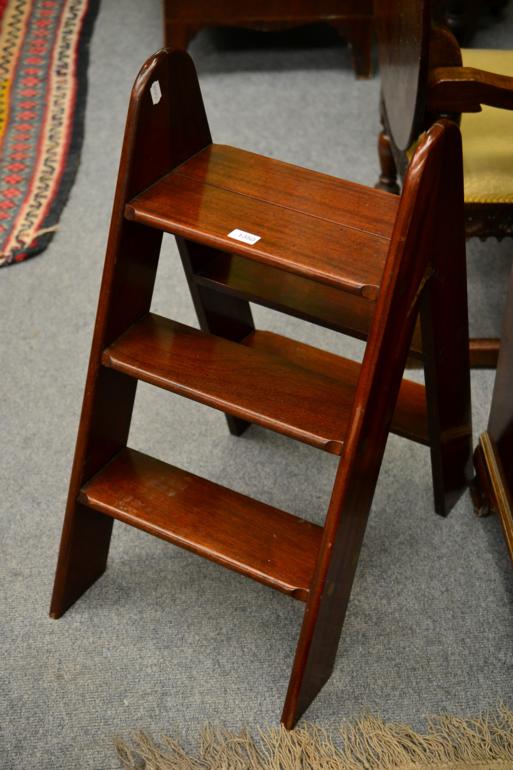 A Set of Mahogany and Brass Bound Folding Steps, with pivoting hinge and three treads fitted to each