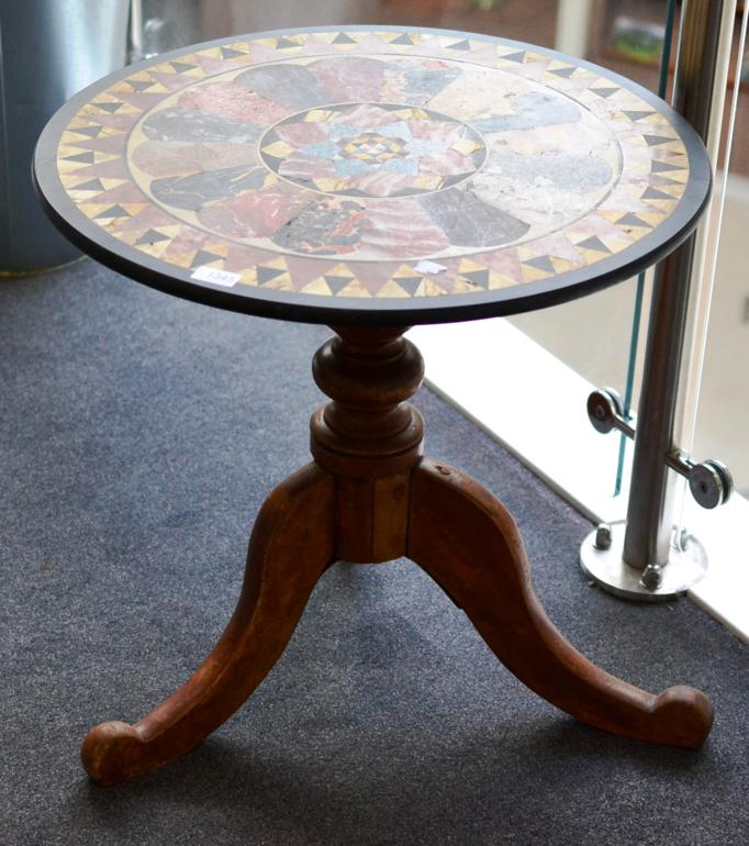 A Circular Specimen Marble Table Top, made up of various marbles surrounded by a geometric