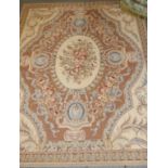 Needlepoint Carpet China, circa 1980 The mocha field with garlands around an oval floral panel