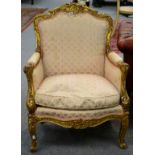 A 19th Century Carved Giltwood Armchair, late 19th century, in Louis XV style, recovered in cream,