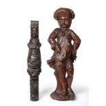 ^ An 18th Century Carved Oak Figure of a Young Boy, wearing a hat, in traditional costume, 69cm