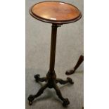 A Victorian Cast Iron Telescopic Stand, the circular mahogany dished top raised on a reeded