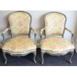 A Pair of Louis XV Style Green Painted Fauteuils, recovered in floral silk damask with padded back