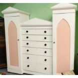 ~ A Victorian Painted Pine Gothic Style Wardrobe, each wing with arched cupboard doors enclosing