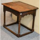 A Late 17th Century Oak Joined Side Table, two piece top, frieze drawer carved A.T, turned