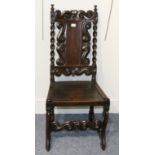 A Charles II Oak Side Chair, Yorkshire, carved crown, scrollwork and barleytwists above solid seat