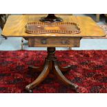 ~ A George IV Mahogany Sofa Table, 2nd quarter 19th century, with two rounded drop leaves above