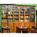 ~ A Victorian Mahogany Six Door Library Bookcase, mid 19th century, the moulded cornice above lancet