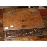 A Late 17th Century Boarded Desk Box, hinged slope lid, with three drawers to interior, carved