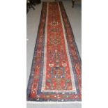 Narrow Heriz Runner Iranian Azerbaijan The deep terracotta field with a row of cruciform