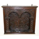 A 17th Century and Later Oak Wall Hanging Cupboard, Westmorland, of twin arched form, heavily carved