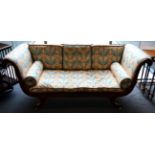 A Regency Style Mahogany Sofa, recovered in multi-coloured fabric with a scrolled and reeded
