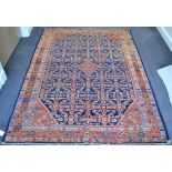 Hamadam Senneh Rug Iranian Kurdistan The indigo Herati field centred by a stepped medallion framed