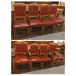 A Set of Eight Early 20th Century Oak Dining Chairs, covered in nailed red leather with padded