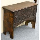 A Late 17th Century Oak Coffer, hinged lid, above a heavily carved front panel, shaped ends, 82cm