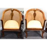 ^ A Pair of 1920s Walnut Bergeres, with overstuffed seats, raised on acanthus carved cabriole legs