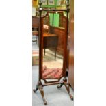 ^ A 19th Century Mahogany and Barber's Pole Strung Cheval Mirror, with shaped rectangular plate