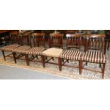 A Set of Six George III Mahogany Dining Chairs, with curved top rails above reeded splats and