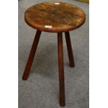 A 19th Century Provincial Pine Circular Table, with some traces of paint, raised on three splayed