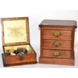 A Victorian walnut box with contents and a three drawer chest