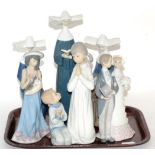 A group of Lladro figures comprising three nuns, wedding couple, girl and dog, and boy and girl