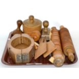 A group of 19th century butter and shortbread moulds, rolling pins, etc